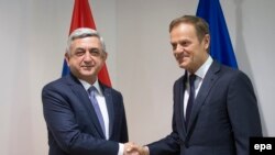 Armenian President Serzh Sarkisian (left) meets with European Council President Donald Tusk while in Brussels on February 27. 