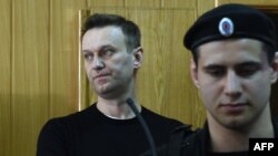 Russian opposition leader Aleksei Navalny attends a court hearing after being detained at a protest rally against corruption in Moscow on March 27.