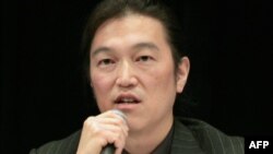 Japanese journalist Kenji Goto delivers a lecture during a symposium in Tokyo in October 2010.