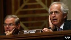 U.S. -- Senate Foreign Relations Committee ranking member Sen. Bob Corker (R-TN) (R) speaks during a hearing with committee chairman Sen. Robert Menendez (D-NJ) (L) in Washington, July 9, 2014