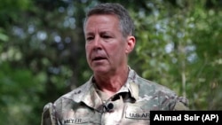 Austin Miller, the top U.S. general in Afghanistan, speaks to journalists in Kabul on June 29. "I still have the authority to support and defend the Afghan security forces and certainly defend ourselves as well," he said.