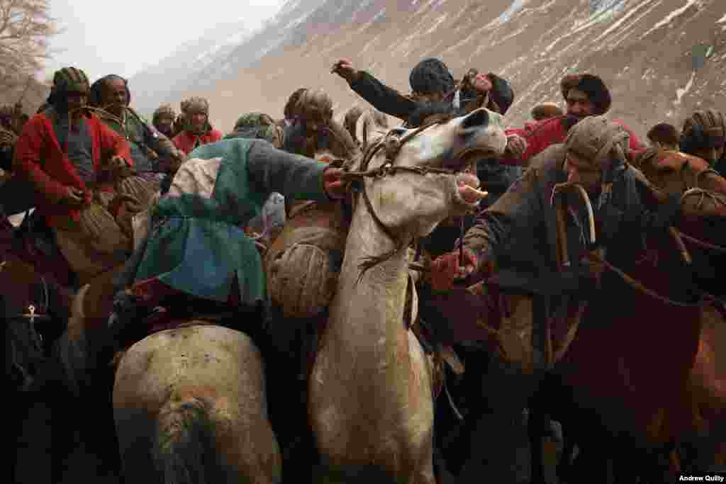 History has trodden heavily through Afghanistan. In this image of a typically vigorous game of buzkashi, the participants wear what appear to be Soviet tank-crew helmets from the U.S.S.R.&#39;s decade-long invasion of Afghanistan.