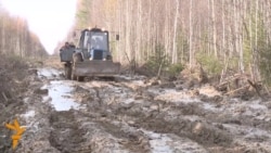 A Muddy Tractor Ride Through Siberia