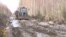 A Muddy Tractor Ride Through Siberia