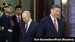 Russian President Vladimir Putin and Chinese President Xi Jinping attend a meeting at the Kremlin in Moscow in May.