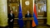 Armenia - Prime Minister Hovik Abrahamian (R) and the head of the EU Delegation, Traian Hristea, speak at a ceremony in Yerevan,16 Jan2015