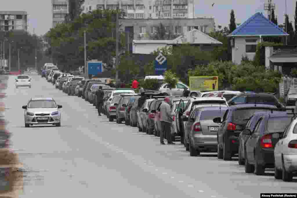 A queue of cars outside a fuel station in Yevpatoria, Crimea, on June 3. Images emerging from the Russian-occupied Crimean Peninsula show a worsening fuel shortage amid a Ukrainian campaign to target Russia's fuel production and logistics.