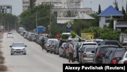 A queue of cars outside a fuel station in Yevpatoria, Crimea, on June 3. Images emerging from the Russian-occupied Crimean Peninsula show a worsening fuel shortage amid a Ukrainian campaign to target Russia's fuel production and logistics.