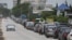 Ukraine -- Cars queue on a road for fuel at a gas station 