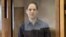 Evan Gershkovich stands inside the defendants' cage during a hearing on the extension of his pretrial detention at the Moscow City Court on March 26.