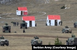Quadruped robots are seen entering dummy buildings during the Serbian military exercise.