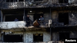 Жилой дом в Киеве, сильно поврежденный российским воздушным ударом. 14 октября 2026 года