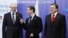 Russian President Dmitry Medvedev (center) is welcomed by European Council President Herman Van Rompuy and EU Commission President Jose Manuel Barosso in Brussels on December 15.