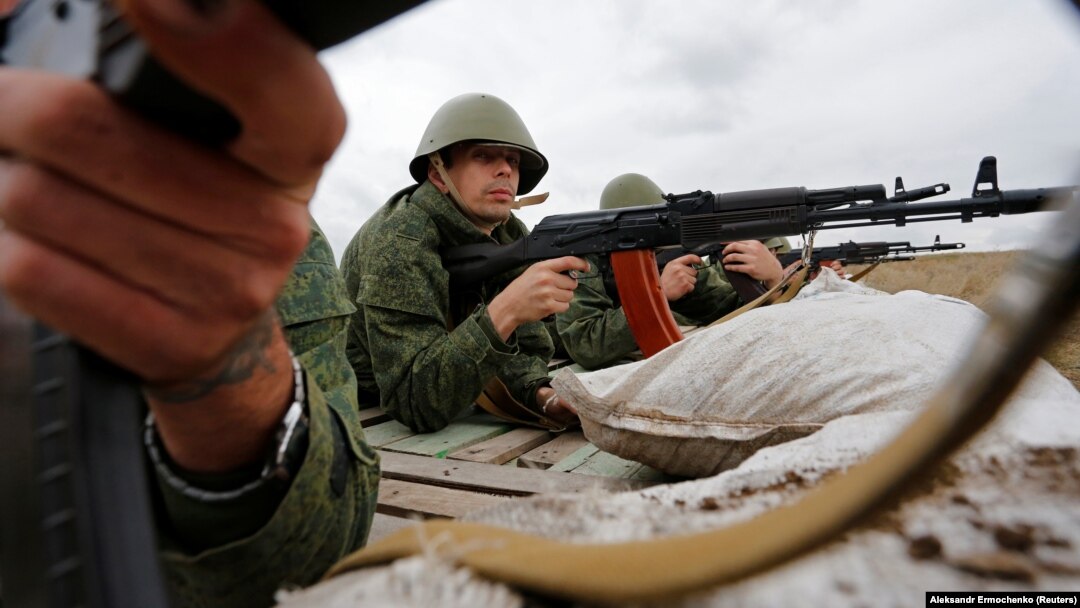 Russia-backed fighters take part in a training exercise outside the separatist-controlled city of Luhansk in eastern Ukraine in September.