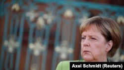 GERMANY -- German Chancellor Angela Merkel looks on next to Russian President Vladimir Putin (not pictured) at the guest house Meseberg Palace in Gransee, Germany August 18, 2018