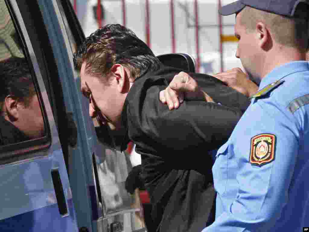 Bjelorusija - Andrzej Poczobut, novinar poljske Gazete Wyborcza, uhapšen je zbog klevete i vrijeđanja bjeloruskog predsjednika, Grodno, 28.06.2011. Foto: AP / Sergei Grits