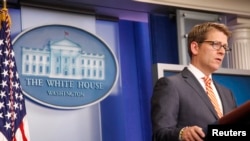 White House spokesman Jay Carney said President Barack Obama was ready to veto any legislation imposing new sanctions on Iran.