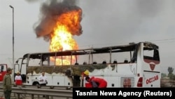 Firefighers are seen at the scene of the gas pipeline explosion in the Southwestern province of Khuzestan, March 14, 2019