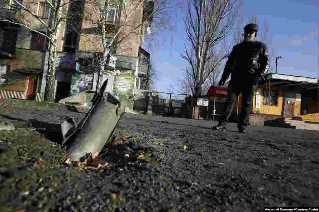 Remnants of a rocket embedded in the pavement in Debaltseve in November 2014. &nbsp; In seven years of covering the war, Stepanov has survived several close calls. Once, a tank took aim at the position he was sharing with several soldiers; after fleeing and taking cover, the group returned to find the position completely destroyed. &nbsp;