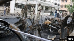 The aftermath of one of 16 bombs that rocked the Indian city of Ahmedabad on July 26