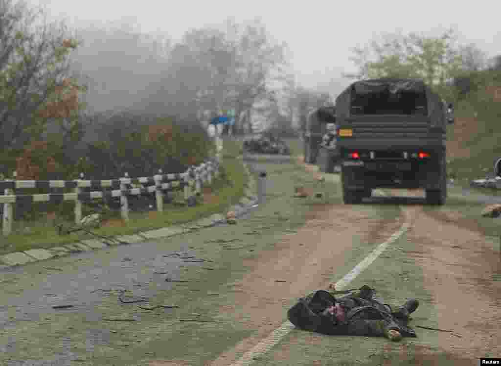 A body lies on the road near Shushi (known as Susa in Azeri). The pictures in this gallery were shot from a convoy of Russian peacekeepers driving near the town on November 13. The insertion of Russian peacekeepers into the region was part of a cease-fire agreement between Azerbaijan and Armenia made on November 9.&nbsp;