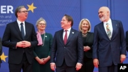 Serbian President Aleksandar Vucic (left), European Commissioner for Neighborhood and Enlargement Oliver Varhelyi (center) and Albanian Prime Minister Edi Rama (right) talk during a photo in Tirana on February 29.