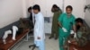 Wounded Afghan National Army soldiers receive treatment in a hospital after a suicide bomber blew himself up inside a packed mosque on a base in Khost Province on November 23.