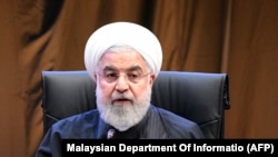 MALAYSIA -- Iranian President Hassan Rouhani attends the first round table session of the Kuala Lumpur Summit 2019 in Kuala Lumpur, December 19, 2019