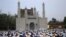 Muslims take part in Eid Al-Adha prayers in Jammu, Kashmir. 