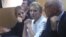Former Ukrainian Prime Minister Yulia Tymoshenko (center) and her daughter Yevhenia (left) listen during a court session in Kyiv in September 2011.