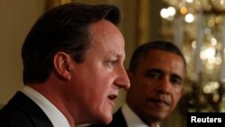Премьер-министр Великобритании Дэвид Кэмерон (слева) и президент США Барак Обама. Вашингтон, 13 мая 2013 года.