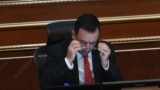 Çfarë thuhet në punimin ku Dimal Basha ishte bashkautor?