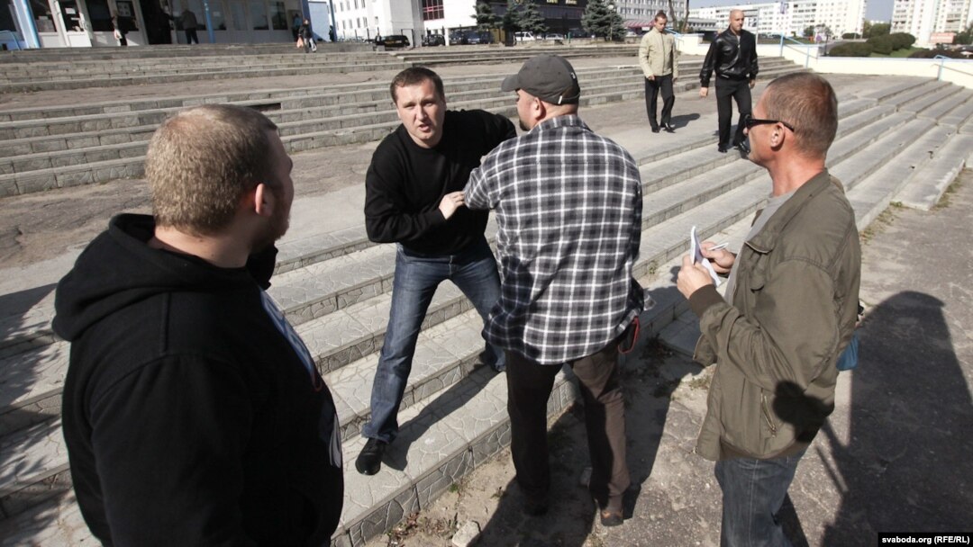 Plainclothes police detain journalists covering a protest action in Minsk on September 18.