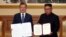 NORTH KOREA -- South Korean President Moon Jae-in and North Korean leader Kim Jong Un pose for photographs with the joint statement in Pyongyang, September 19, 2018