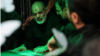 IRGC chief Ahmad Vahidi his respects in Tehran before the body of Ali Khamenei on July 3. 