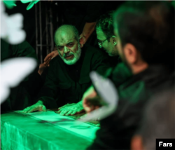 Ahmad Vahidi pays his respects before the body of Iranian Supreme Leader Ali Khamenei in Tehran on July 3.
