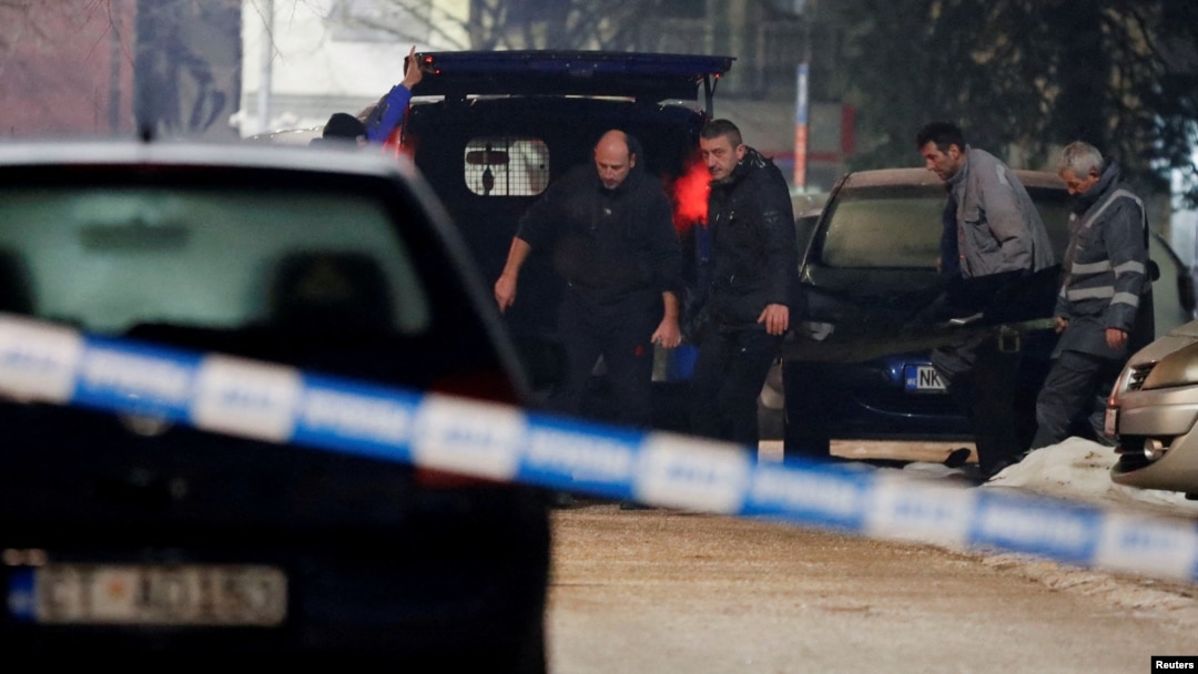 Emergency workers remove the body of one of the victims who died in a shooting rampage in the Montenegrin city of Cetinje on January 1. 
