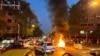 A police motorcycle burns during a protest in Tehran on September 19.