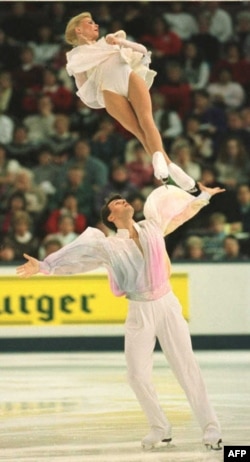 Russian pairs figure skaters Vadim Naumov and Evgenia Shishkova compete at the World Figure Skating Championships in Edmonton, Canada, in 1996.