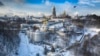 A bird flies near the 1000-year old Orthodox Monastery of Caves, covered with the first snow of winter in Kyiv on January 15. (AP/Efrem Lukatsky)&nbsp;