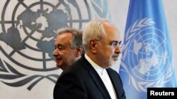 Iranian Foreign Minister Mohammad Zarif walks past United Nations Secretary-General Antonio Guterres at U.N. Headquarters in New York, July 17, 2017 - FILE PHOTO