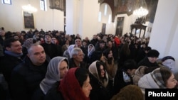 Armenia - Worshippers attend a Christmas mass at the Echmiadzin cathedral of the Armenian Apostolic Church, January 6, 2024.