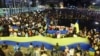 Demonstrators in Tel Aviv attend a rally in support of Ukraine after Russia launched a massive military operation against its neighbor.