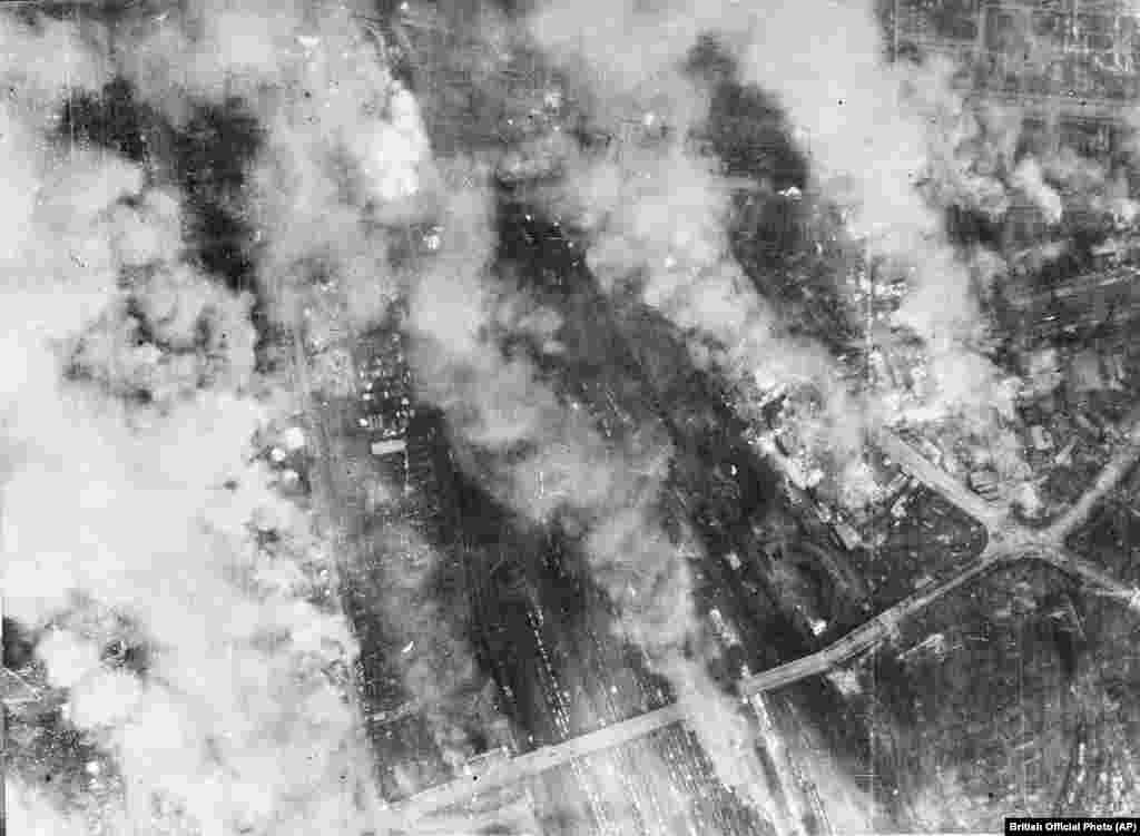 The smoldering outskirts of Dresden during the attack. Three hours after the first air raid, as Dresden&#39;s firefighters were battling the blazes and surviving civilians were clambering out of their shelters, a second wave of British bombers dumped another 1,800 tons of bombs from the night sky onto the flaming city. &nbsp;