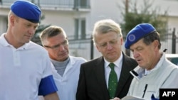 The head of the EU observer mission in Georgia, Hansjoerg Haber (second from right), with his colleagues in the town of Mukhrani on October 1