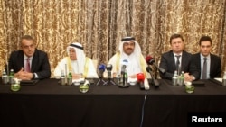 Russian Energy Minister Aleksandr Novak with OPEC oil ministers at a meeting in Qatar where a joint output freeze was discussed.