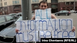 A protester demonstrates against censorship of the Internet near the State Duma in Moscow.