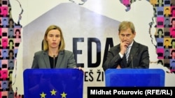 EU foreign-policy chief Federica Mogherini (left) and Enlargement Negotiations Commissioner Johannes Hahn in Sarajevo on December 5