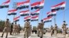 Iraqi Shi'ite volunteers who have joined government forces to fight Sunni jihadists from the Islamic State take part in a training session near the southern port city of Basra.