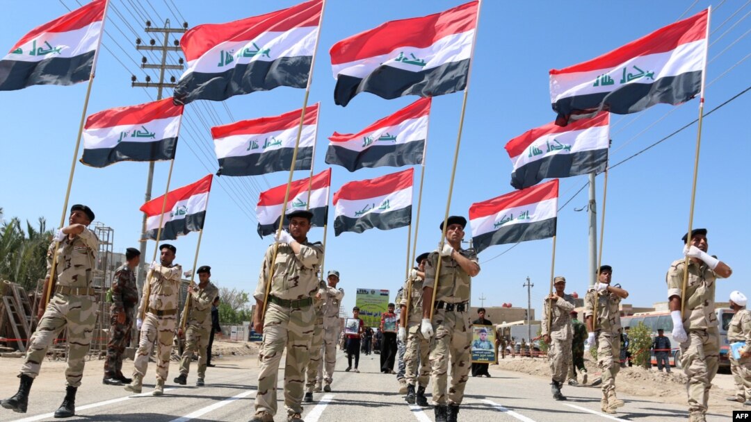 Iraqi Shi'ite volunteers who have joined government forces to fight Sunni jihadists from the Islamic State take part in a training session near the southern port city of Basra.